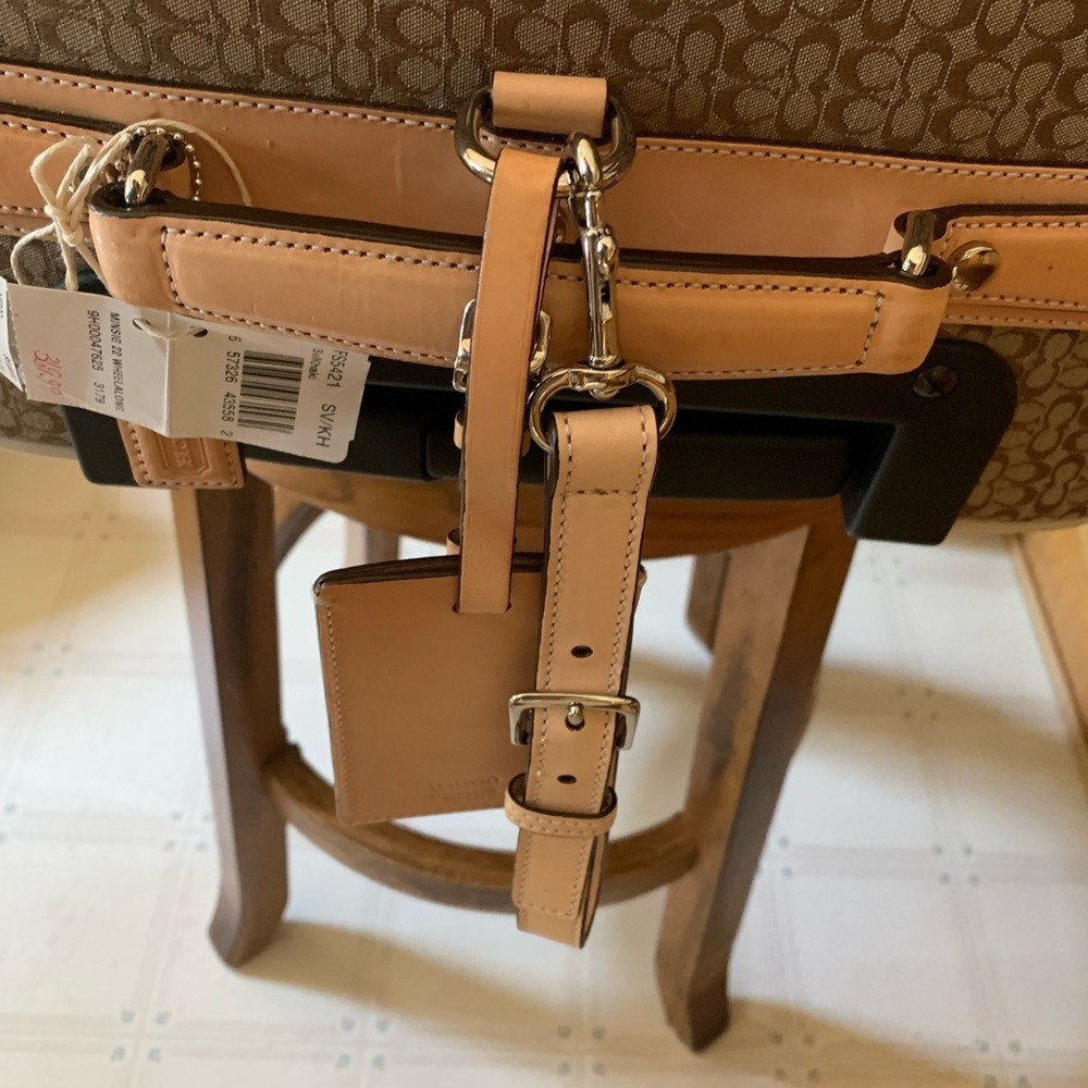Coach Signature Rolling Carry On